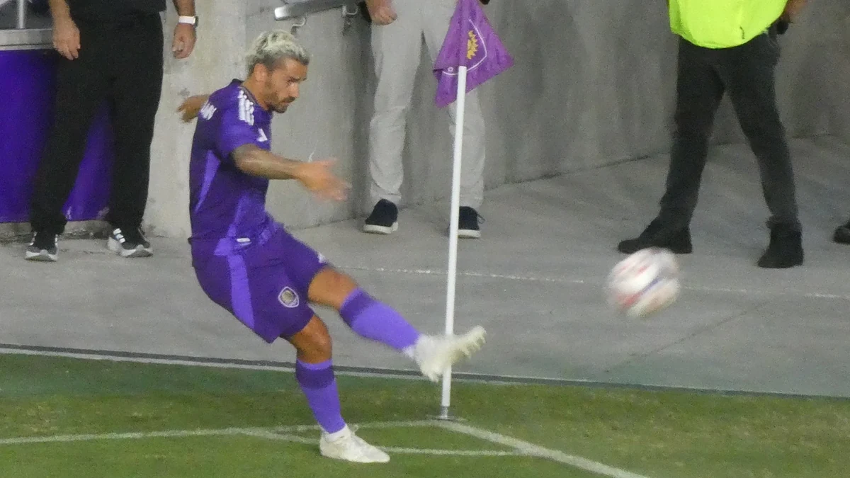 Antoine Griezmann takes a corner kick in Orlando City's purple kit during the 2026 MLS season. Photo: Keiteay / Wikimedia Commons (CC BY 4.0).