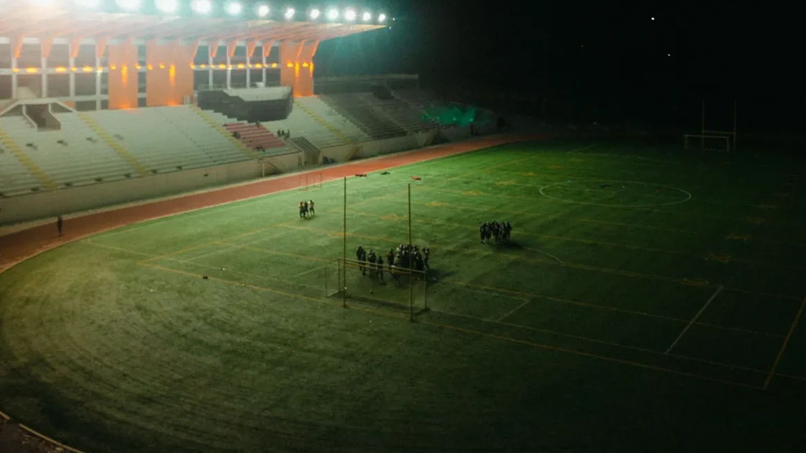 A floodlit football stadium under lights on a Champions League night. Photo: Emessem T / Wikimedia Commons (CC BY-SA 4.0).