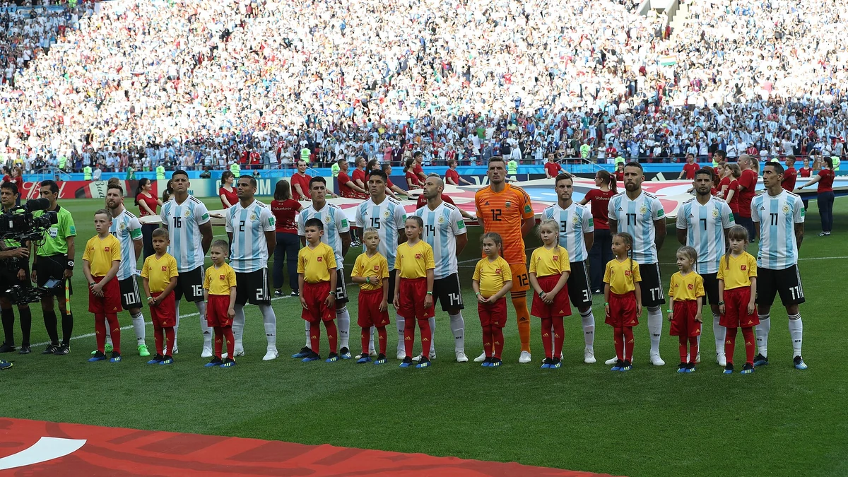 Argentina's team lines up with child mascots before their 2018 World Cup match against France, Lionel Messi (No. 10) at left. Photo: Министерство спорта Республики Татарстан / Wikimedia Commons (CC BY 4.0).